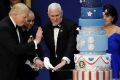 President Donald Trump and Vice President Mike Pence cut the cake.