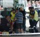 Ambulance paramedics treat an injured pedestrian on Bourke Street.