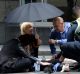 Bystanders comforted the injured in Bourke Street.