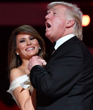 U.S. President Donald Trump sings along with the music as he dances with First Lady Melania Trump during the Liberty ...