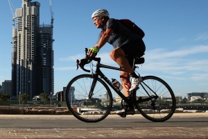 A cyclist against the backdrop of Sydney's Barangaroo. 