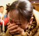 Anguish in Beijing as relatives learn MH370 has gone missing on March 9, 2014.