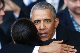 Former President Barack Obama hugs supporters as he prepares to depart Andrews Air Force base.