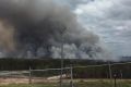 The Coolum bushfire continued to rage on Friday, as seen from the Peregian Springs water tower.