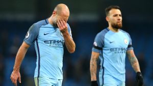 MANCHESTER, ENGLAND - JANUARY 21: Pablo Zabaleta of Manchester City (L) looks dejected after the Premier League match ...