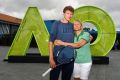 Denis Istomin gives his mother and coach Klaudiya a hug after his Australian Open heroics.