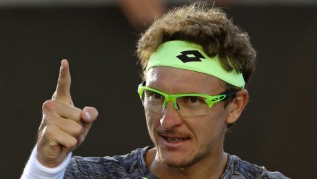 Zero to hero ... Uzbekistan's Denis Istomin celebrates after defeating Spain's Pablo Carreno Busta in the third round of ...