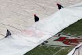 Ground crew at Kansas City's Arrowhead Stadium, where an ice storm is due to hit.