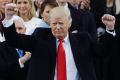 President Donald Trump pumps his fist after delivering his inaugural address.