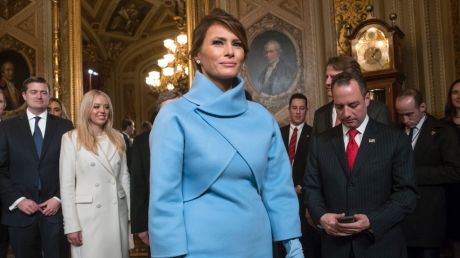 First lady Melania Trump wore a light blue suit, reminiscent of Jackie Kennedy's famous look.