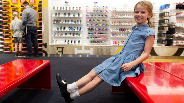 Asha Taylor tries on new school shoes at Shoes & Sox, in Bondi Junction, Sydney.