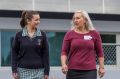 Year 9 student Stephanie Ruschin talks with Bendigo Bank manger and mentor Cathie Kerr-Neilson at Newcomb Secondary College.