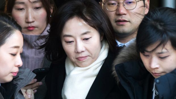 South Korean Culture Minister Cho Yoon-sun, center, leaves the Seoul Central District Court in Seoul after attending a ...