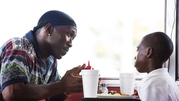 Juan (Mahershala Ali) and young Chiron (Alex Hibbert) in <i>Moonlight</i>.