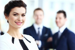 08122016. Photo: 123rf.com
Face of beautiful woman on the background of business people