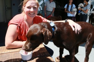 Melissa Renwick - owner of The Keg Room and Eatery with her dog Malt enjoying a Doggicino.