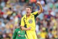 James Faulkner of Australia celebrates the wicket of Sharjeel Khan of Pakistan at the MCG on Sunday.