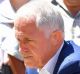 Malcolm Turnbull lays flowers in Bourke Street.