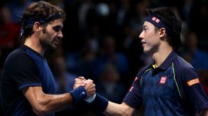 Roger Federer shakes hands with Kei Nishikori after his victory in their match at Barclays ATP World Tour Finals in 2015 ...
