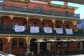 Some of the offensive banners which have forced the Brass Monkey Hotel into issuing an apology. 