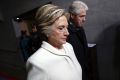 Former Presidential Bill Clinton and wife Hillary Clinton arrive on the West Front of the Capitol in Washington, Friday, ...