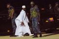 Yahya Jammeh (in white) heads for exile at Banjul airport.