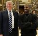 President-elect Donald Trump and Kanye West pose for a picture in the lobby of Trump Tower.