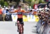 Richie Porte celebrates on Willunga Hill as he crosses the line to win stage five of the Tour Down U