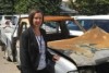 Tasmania Police Sergeant Penny Reardon with a burnt out ute.