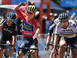 Australian rider Caleb Ewan of team Orica-Scott (centre) celebrates winning stage four of the Tour Down Under ahead of world champion Peter Saga of team Bora-Hansgrohe (right) in Campbelltown near Adelaide, Friday, Jan. 20, 2017. (AAP Image/Dan Peled) NO ARCHIVING, EDITORIAL USE ONLY