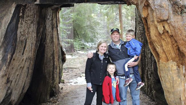 This May 2016 photo provided by Michael Brown shows Sebastian Bull, his wife Amy Bull, and their children Camden and Brady Bull, posing in the Pioneer Cabin tunnel tree, a giant sequoia that had a tunnel carved into it in the 1880s, during a visit to Calaveras Big Trees State Park near Arnold, Calif. The tree was toppled over by a massive storm Sunday, Jan. 8, 2017. Four generations of Brownâ€™s family have spent countless hours at the tree and often took out-of-town visitors there, some from as far away as Turkey. (Michael Brown via AP)