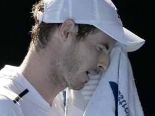 Britain's Andy Murray wipe his face while playing Germany's Mischa Zverev during their fourth round match at the Australian Open tennis championships in Melbourne, Australia, Sunday, Jan. 22, 2017. (AP Photo/Aaron Favila)