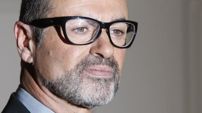 FILE - In this May 11, 2011 file photo British singer George Michael poses for the cameras at an event to announce his European Orchestral tour in London. Austria's state broadcaster says British pop star George Michael has been released from a Vienna hospital and will be able to celebrate Christmas at home. Michael, 48, was being treated for pneumonia. Broadcaster ORF says he was released Thursday, Dec. 22, 2011 from the AKH hospital and is catching a flight to London later in the day. (AP Photo/Alastair Grant, File)