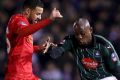 Plymouth Argyle's Paul Arnold Garita and Liverpool's Kevin Stewart battle for the ball.