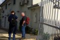 AFP officers outside Richard Vong's house in the Melbourne suburb of Thomastown, which was raided on Wednesday.