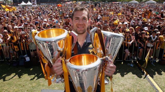  Luke Hodge with the 2013, 2014 and 2015 premiership trophies.