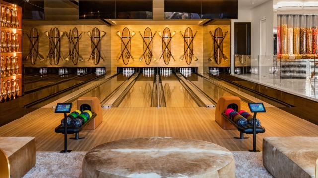 The bowling alley has four lanes and comes stocked with bowling shoes in every size.