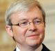 Australia's Prime Minister Kevin Rudd (L) listens as US Secretary of State Hillary Clinton speaks to reporters after a ...