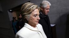 Former Presidential Bill Clinton and wife Hillary Clinton arrive on the West Front of the Capitol in Washington, Friday, ...