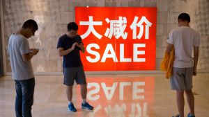 China's economy has grown a bit faster than predicted, as retail sales jump.