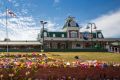 Floral tributes outside Dreamworld where the deaths of four people have raised questions about workplace laws in ...
