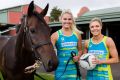 Australian Fast 5 netballers Gretel Tippett (left) and Kate Moloney with He's Our Rokkii, which will be running on Derby Day.