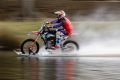 Robbie Maddison rides his modified motorbike along the surface of the Yarra.