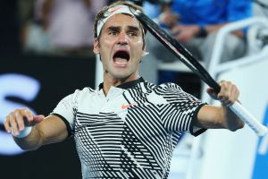 Roger Federer celebrates winning in his fourth-round match against Kei Nishikori.