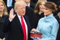 Donald Trump is sworn in as the 45th president of the United States as Melania Trump looks on.