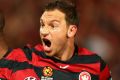 Wanderers Romeo Castelen and Brendon Santalab celebrate during their semi-final win over the Roar.