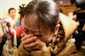 Anguish in Beijing as relatives learn MH370 has gone missing on March 9, 2014.