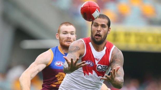 Just in front: Lance Franklin leads Daniel Merrett to the ball on Sunday.