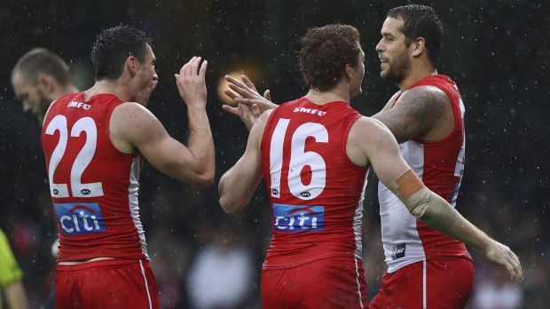 On target: Lance Franklin revelled in the wet, booting four goals.