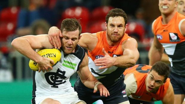 Shane Mumford tackles Carlton's Sam Doherty at Spotless Stadium.